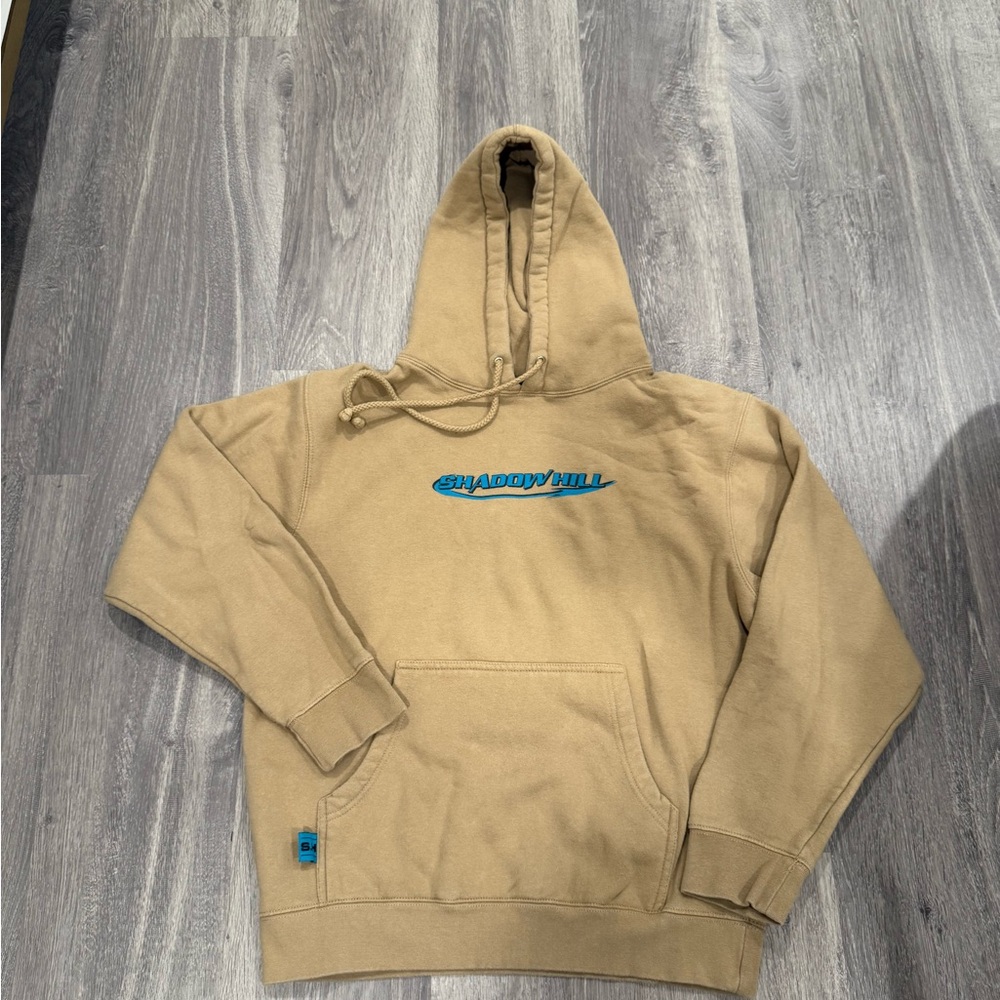 Shadow Hill Tan Sweater with blue logo